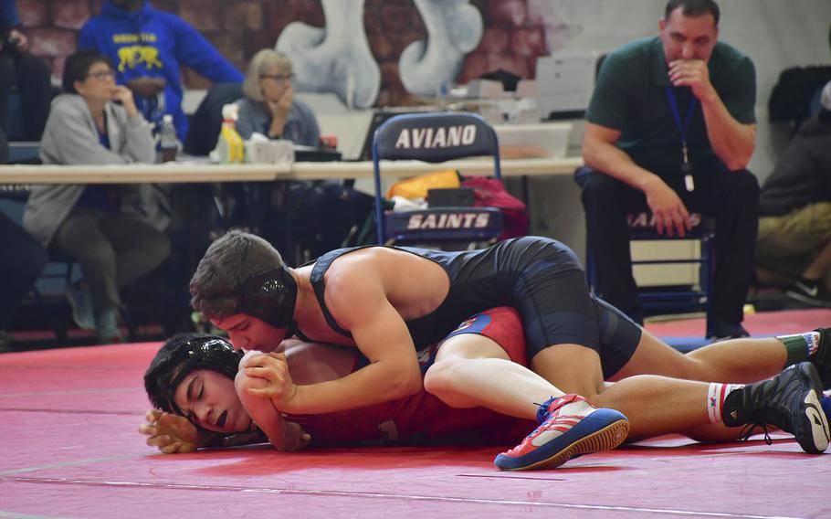 Roberts Swart, a junior from Ankara, works on pinning Blake Fluck from Aviano during a wrestling tournament held at Aviano Air Base on Saturday, January 12, 2019. Swart will be the only wrestler from Ankara participating in a sectional tournament this weekend in the hopes of qualifying for the season-ending championships Feb. 22-23.