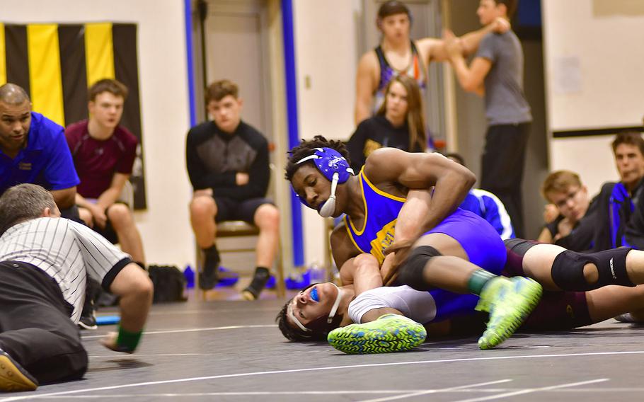 Sigonella's Amari Pyatt attempts to pin Phoenix Blumenshine of Vilseck. Pyatt was expected to easily advance to the European Championship and did so with a sweep in the 170-pound bracket.