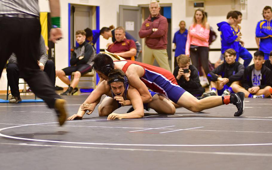 Aviano's Daniel Merrill attempts to pin Rota's Easton Colvin. Merrill took the third-place match and with the win, advanced to the European championships.
