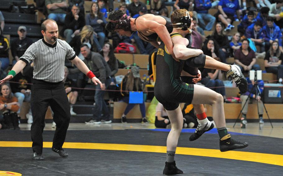 SHAPE's Sean Kilrain lifts Vilseck's Hyrum Draper on his way to winning the 160-pound title at the DODEA-Europe wrestling championships in Wiesbaden, Germany, Saturday, Feb. 16, 2019. 





