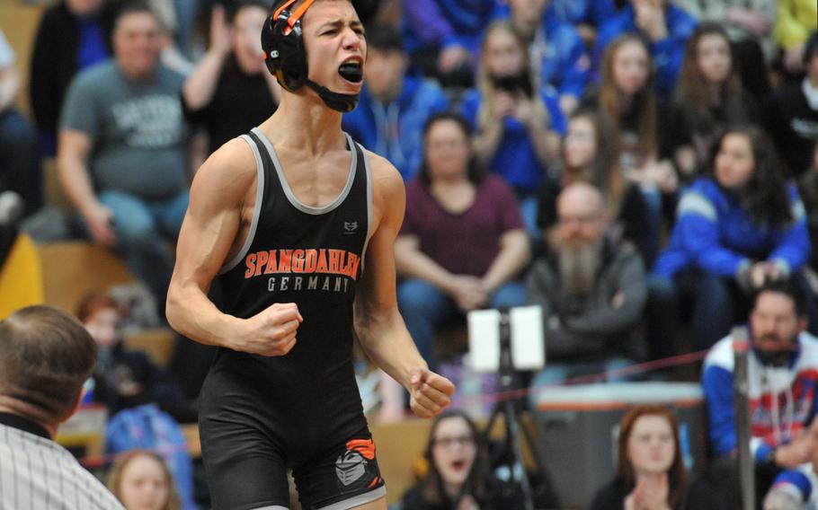 Carson Hicks celebrates after defeating Ramstein's Matthew Oreskovich in the 113-pound championship match at the DODEA-Europe wrestling finals in Wiesbaden, Germany, Saturday, Feb. 16, 2019. 





