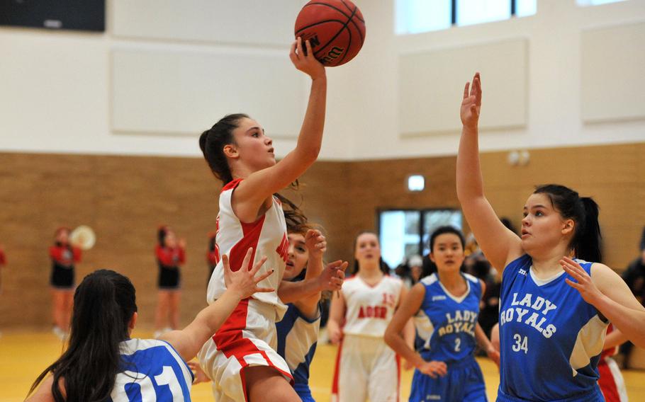 AOSR's Amaya Vaquerizo shoots over Marymount's Anna Aboltina in a Division II game at the DODEA-Europe basketball championships in Wiesbaden, Germany. AOSR won 28-16 in a matchup of teams from Rome.