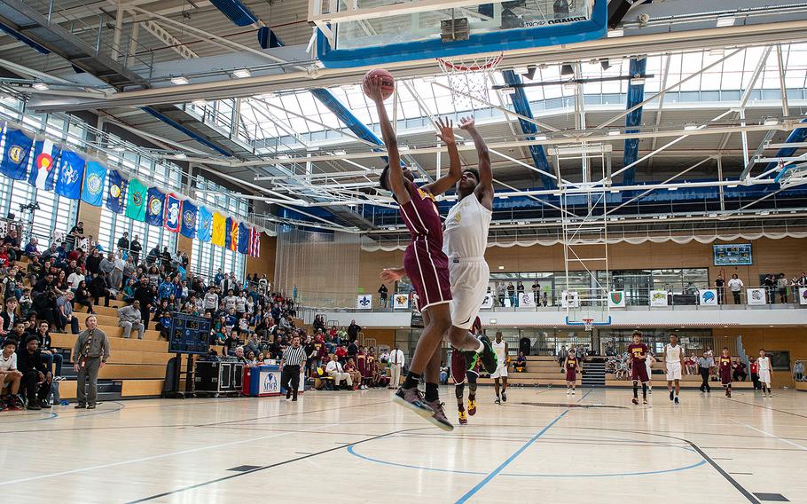 Baumholder's Lawrence Huxtable goes up for a lay-up during the Division III basketball championship game between Baumholder and Ansbach at Clay Kaserne Fitness Center, Germany, Saturday, Feb. 23, 2019. Baumholder won the game 70-65. 
