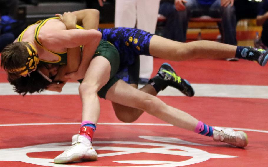Yokota's Ramil Celones and Edgren's Levi Rick fight for control at 135 pounds.