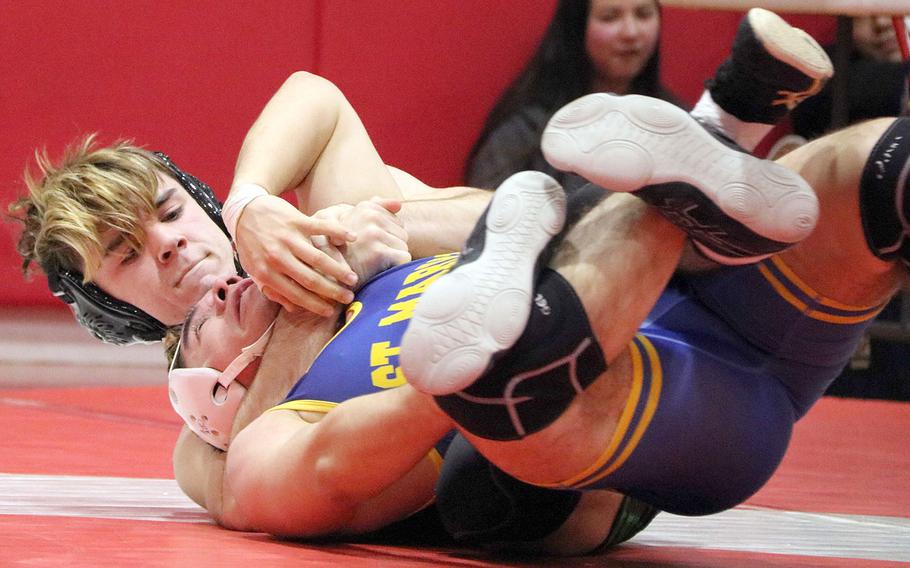Kubasaki's Luke Moseley takes control of St. Mary's Cole Lawlor at 148 pounds.