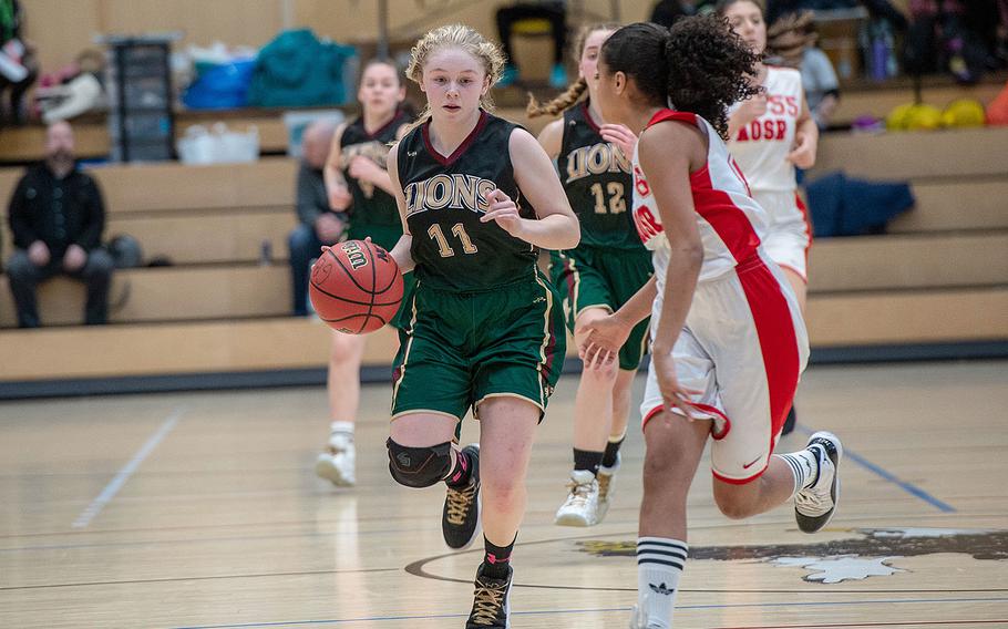 AFNORTH's Tori Morris dribbles down the court during the Division II basketball championship game between AFNORTH and AOSR at Clay Kaserne Fitness Center, Germany, Saturday, Feb. 23, 2019. AOSR won the game 20-15. 