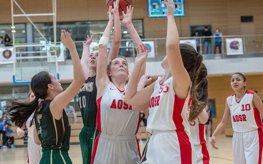 Players go up for a rebound during the Division II basketball championship game between AFNORTH and AOSR at Clay Kaserne Fitness Center, Germany, Saturday, Feb. 23, 2019. AOSR won the game 20-15. 