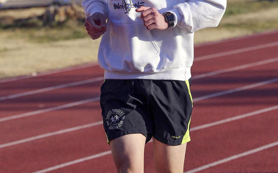 Yokota distance runner Mickey Galvin goes through his practice paces.