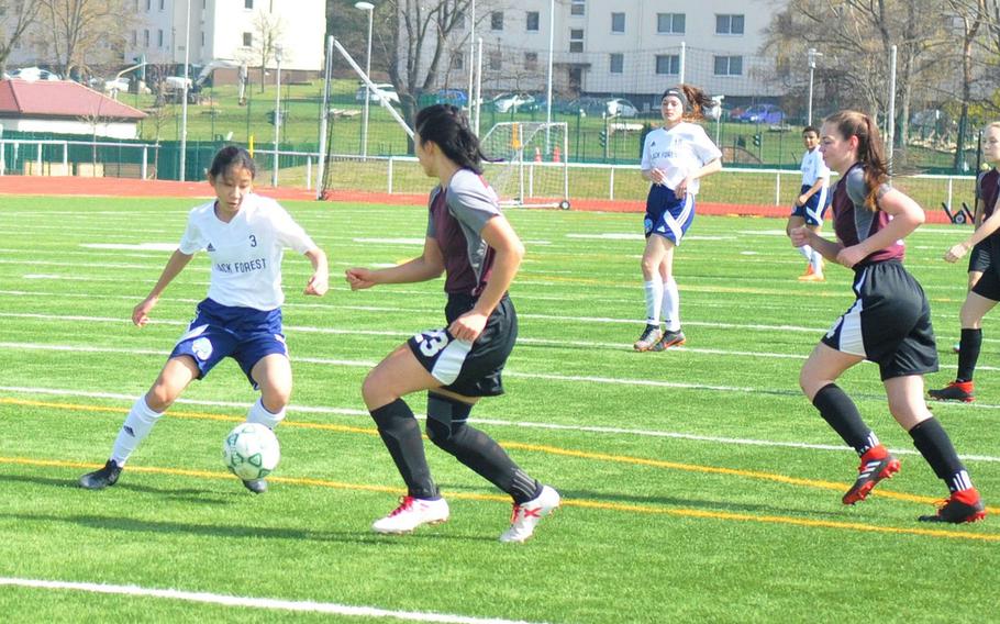 Black Forest Academy freshman Yewon Park makes a move in her team's 6-0 defeat of the AFNORTH Lions on Saturday, April 6, 2019, at Kaiserslautern High School. Park scored three goals. 
