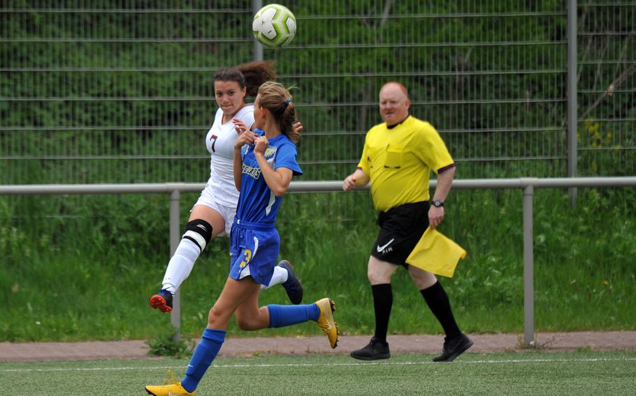 Baumholder's Kaleena Sais gets off a cross against SigonellaÕs Evie Kerr in a Division III game at the DODEA-Europe soccer finals in Landstuhl, Monday, May 20, 2019. The game ended in a tie and Sigonella took the penalty tiebreaker.










