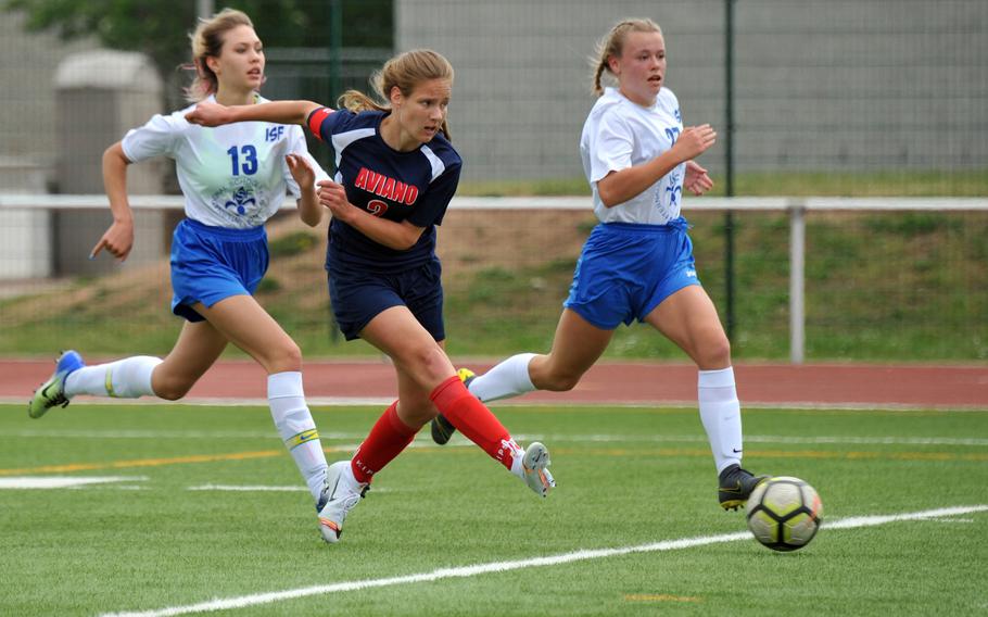 Aviano's Danielle Kandle gets off a shot after getting past Florence's Tatiana Pronina, left, Yeva Biba in a Division II game at the DODEA-Europe soccer finals in Kaiserslautern, Monday, May 20, 2019. Aviano won 3-0.











