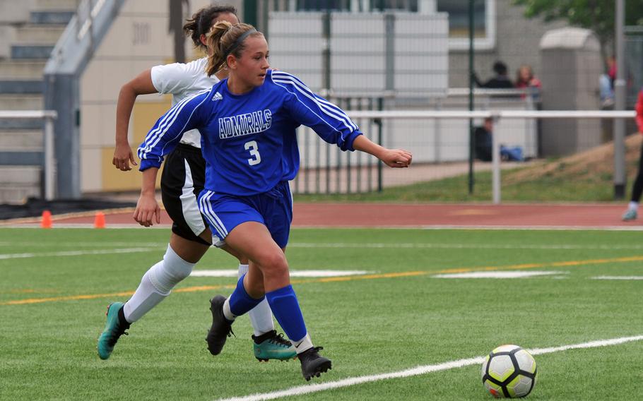 Rota's Kendall Salazar gets away from AFNORTH's Alexa Sicardo in a Division II game at the DODEA-Europe soccer finals in Kaiserslautern, Monday, May 20, 2019. Rota won 3-0.











