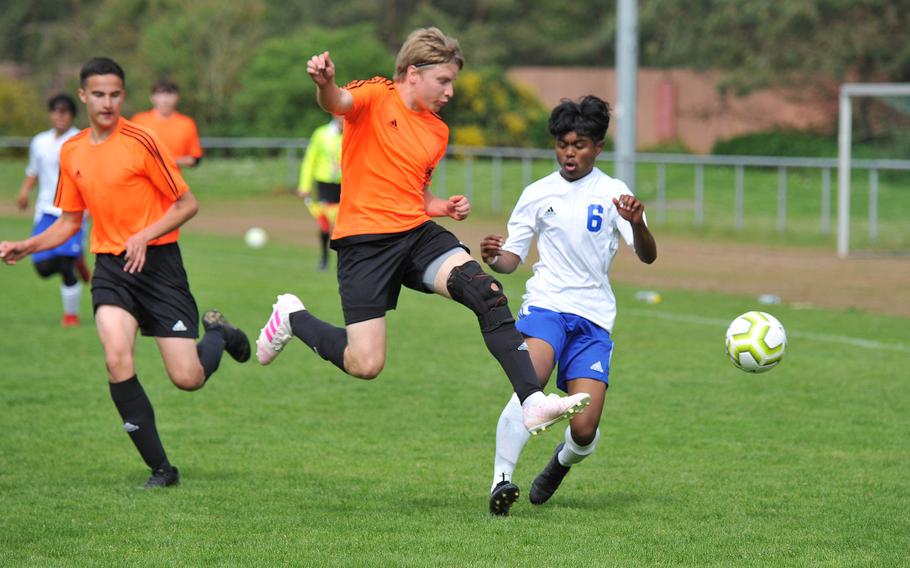 Spangdahlem's Brian Haney comes across to clear the ball in front of Hohenfels' Riley Ngiraibai in a Division III game at the DODEA-Europe soccer finals in Landstuhl, Monday, May 20, 2019. The game ended in a 3-3 tie and Spangdahlem won the penalty tiebreaker.










