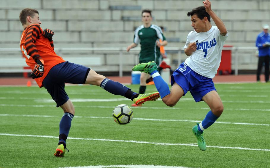 AFNORTH keeper Paul Kohl and Rota's Julian Ramirez go for the ball in a Division II game at the DODEA-Europe soccer finals in Kaiserslautern, Tuesday, May 20, 2019. AFNORTH won 2-1.











