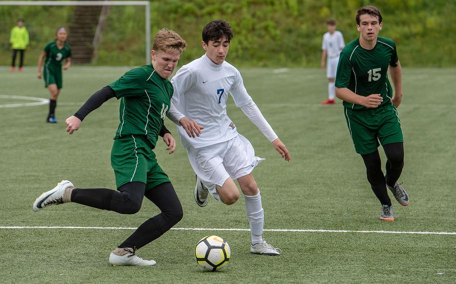 Alconbury's Cameron Rowley and Brussels' Kamran Mammadov race for the ball on the third day of the DODEA-Europe soccer championships, Wednesday, May 22, 2019.
