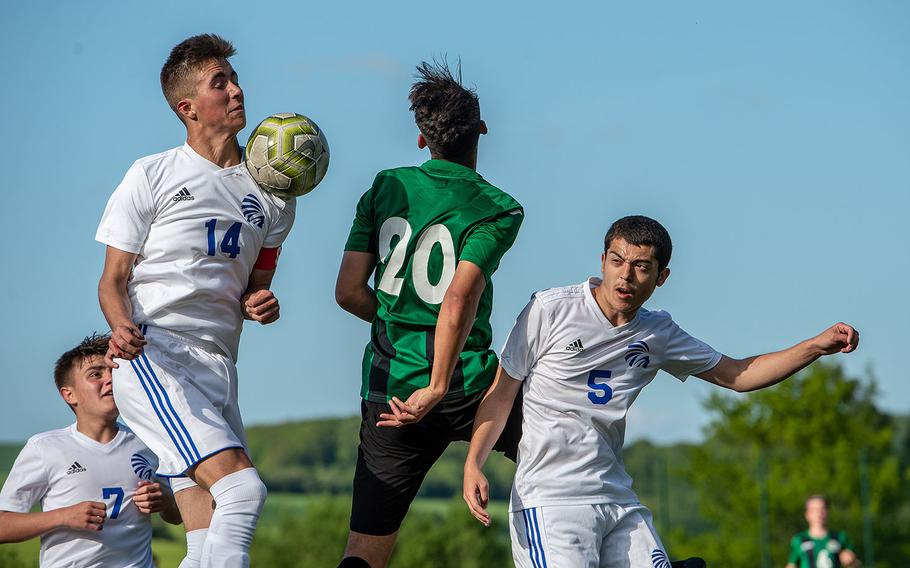 The ball goes off the shoulder of Wiesbaden's Anthony Hall during a Division I semifinal game against Naples on the third day of the DODEA-Europe soccer championships, Wednesday, May 22, 2019.