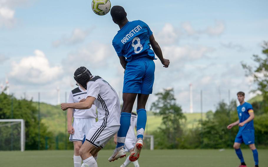 Ramstein's Chukwuemeka Alumanah head the ball toward the goal during a Division I semifinal game against SHAPE on the third day of the DODEA-Europe soccer championships, Wednesday, May 22, 2019.