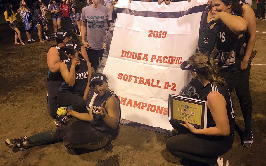 Daegu players gather round the title banner.