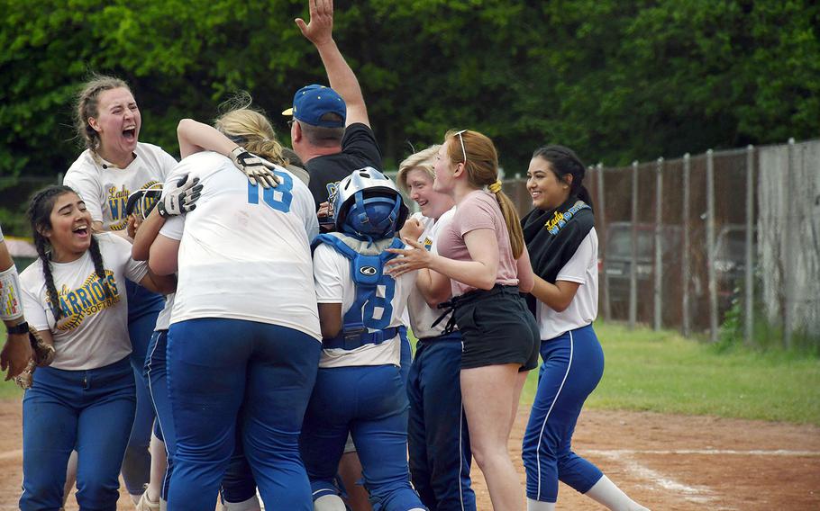 The Wiesbaden Warriors celebrate an unlikely DODEA-Europe Division I softball title on Saturday, May 25, 2019. The Warriors were 4-10 during the regular season before winning all but one of their games in the post-season tournament.