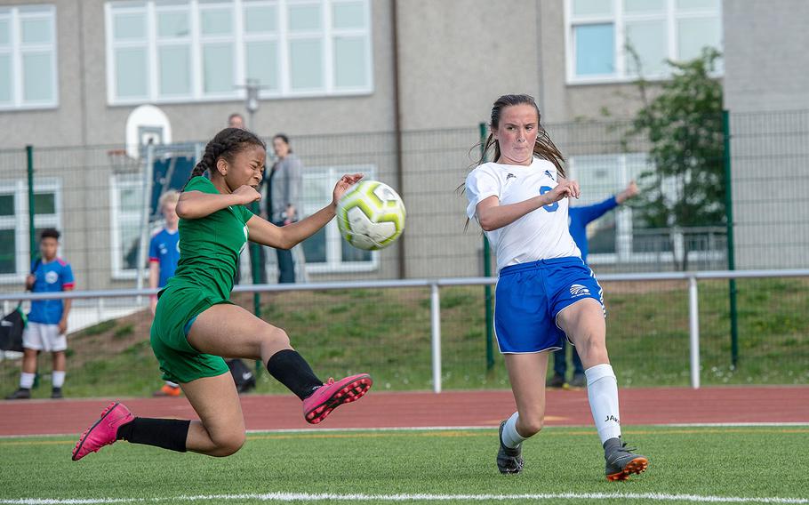 Wiesbaden's Erin Goodman crosses the ball to the center of the field as Naples' Tatiana Manning tries to block during the girls Division I DODEA-Europe soccer championship game, May 23, 2019. Wiesbaden won the game 2-0. 