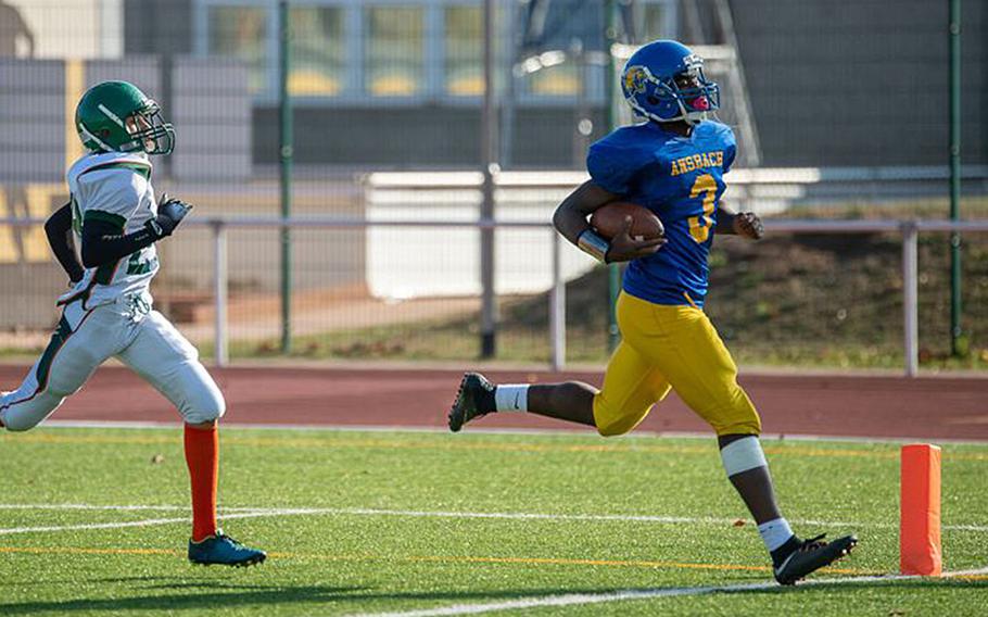 Ogden Andrew from Ansbach scores during the DODEA-Europe Division III football championship game between the Ansbach Cougars and AFNORTH Lions, Saturday, Nov. 3, 2018. 

