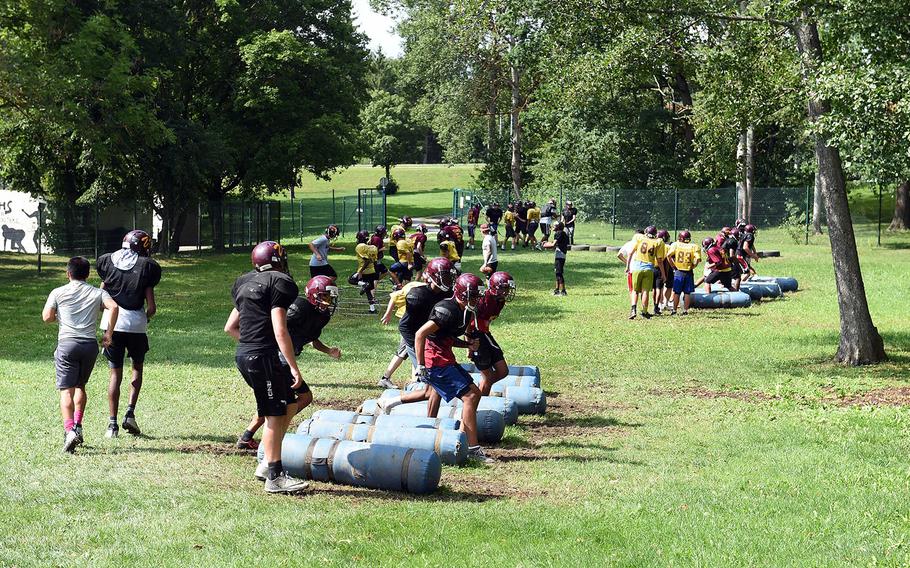 The Vilseck Falcons take on agility stations during practice at Vilseck, Germany, Wednesday, Aug. 21, 2019.