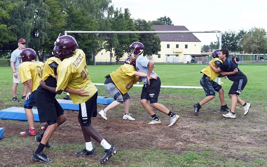 Vilseck Falcons work on tackling during practice at Vilseck, Germany, Wednesday, Aug. 21, 2019. 