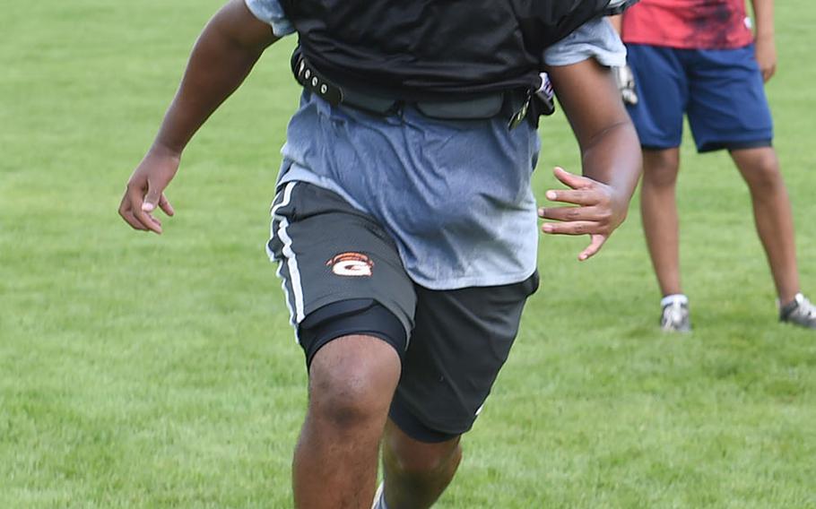 Vilseck's Jonas Mathew, a tackle, works on his conditioning at practice at Vilseck, Germany, Wednesday, Aug. 21, 2019. 