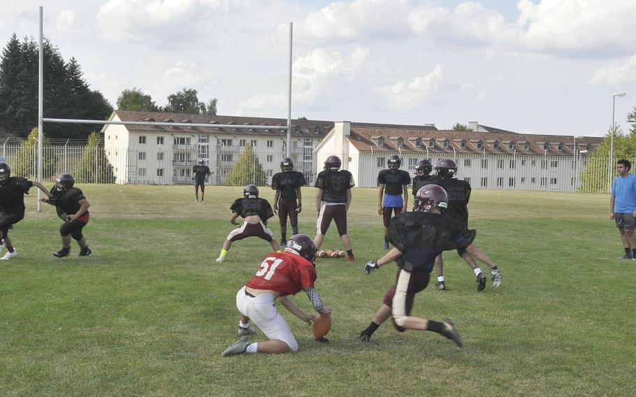 Baumholder Bucs players run through placekicking drills during a preseason football practice Wednesday, Aug. 28, 2019, at Baumholder, Germany. The team is spending substantial practice time on special teams in hope of gaining an edge. 
