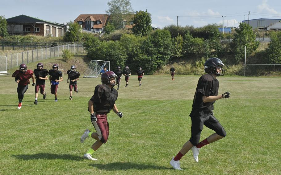 The Baumholder Bucs are emphasizing endurance, including these laps around their practice field Wednesday, Aug. 28, 2019, at Baumholder, Germany, to prepare for a six-man brand of football that requires regular long runs on offense and defense. 