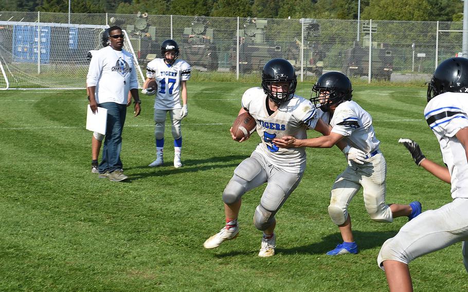 Hohenfels Tiger Brylon Young tackles quarterback Ryan Hale during practice on Wednesday, Aug. 28, 2019. 