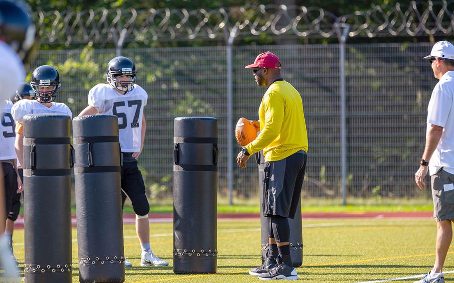 Stuttgart Panthers assistant coach Antoine Reed works with the offensive line in a preseason practice session at Stuttgart, Germany.