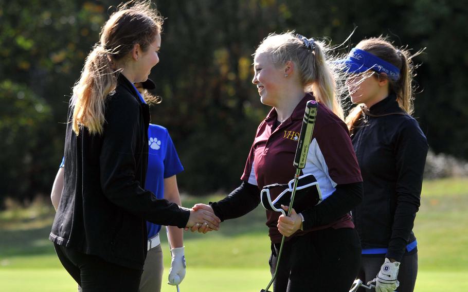 Wiesbaden's Amy Gonzalez, left, congratulates Anniston Fees after the Vilseck senior captured the girls title at the DODEA-Europe golf championships in Wiesbaden, Germany, Thursday, Oct. 10, 2019. Watching are Ramstein's Harley Parks, behind Gonzalez, and Wiesbaden's Heidi Johnson.










