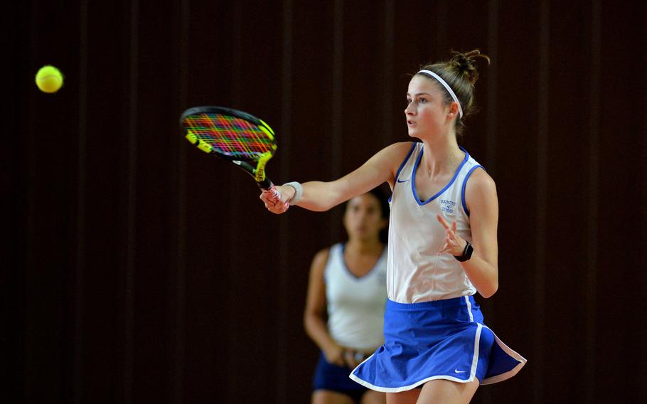 Ramstein’s Dougie Allison returns a ball against Marymount in a girls double match at the DODEA-Europe tennis championships in Wiesbaden, Germany, Thursday, Oct. 24, 2019. Ramstein won the match 7-5, 4-6, 10-5. In the background is Douglas’ teammate Isabella Guzaldo.