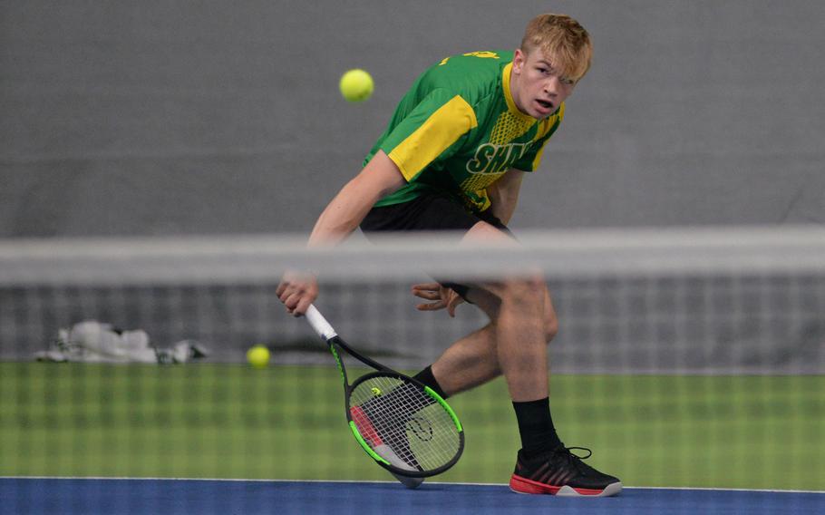 SHAPE's Seth Banken slices the ball back over the net in his 6-0, 6-0 win over Ramstein's Connor Markus at the DODEA-Europe tennis championships in Wiesbaden, Germany, Thursday, Oct. 24, 2019.  