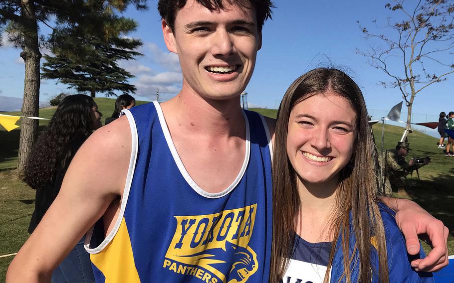 Yokota senior Mickey Galvin and sophomore Aiko Galvin smile after their team relay victory..