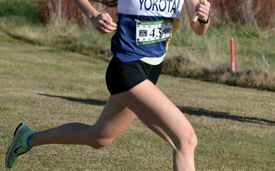 Yokota sophomore Aiko Galvin nears the finish of the third leg of Tuesday's team relay.