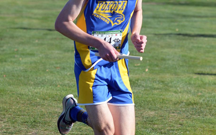 Yokota senior Mickey Galvin heads for the finish of Tuesday's team relay.