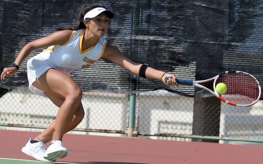 Kadena sophomore Ally Johnson lunges for a forehand return during her Far East tennis singles quarterfinal victory.