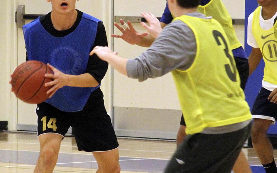 Yokota senior guard David Carlson looks to pass during practice.