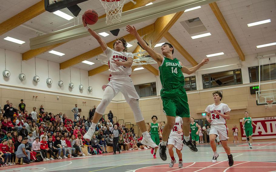 Kaiserslautern's Brandon Morris makes a lay-up during a basketball game between Shape and Kaiserslautern at Kaiserslautern High School, Germany, Friday, Dec. 6, 2019. Kaiserslautern won the game 56-32. 