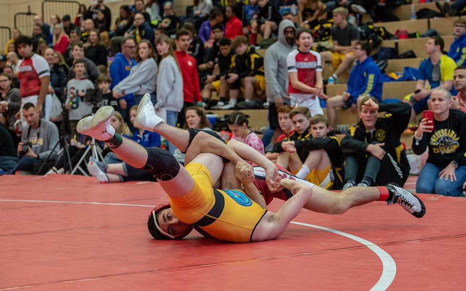 Kaiserslautern's Danny Aldana pins Stuttgart's Carter Hanes during a wrestling tournament at Kaiserslautern High School, Germany, Saturday, Jan. 18, 2020.
