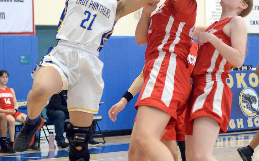 Yokota's Hana Robbins has a shot blocked by Nile C. Kinnick's Madelyn Gallo.