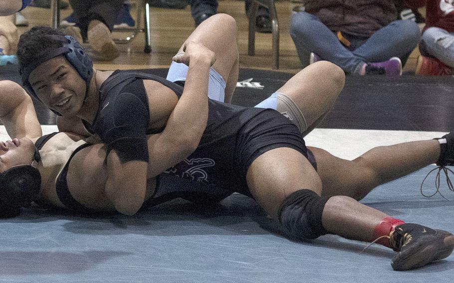 Perry 168-pounder Nemo Matthews pins Osan's Marcus Inthavixay in Thursday's Far East semifinal. Inthavixay won the title at 158 pounds last year.