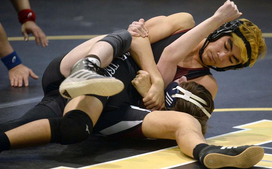 Zama's Kaito Hayashi pins Perry's Marcus Irons in a 122-pound semifinal victory.
