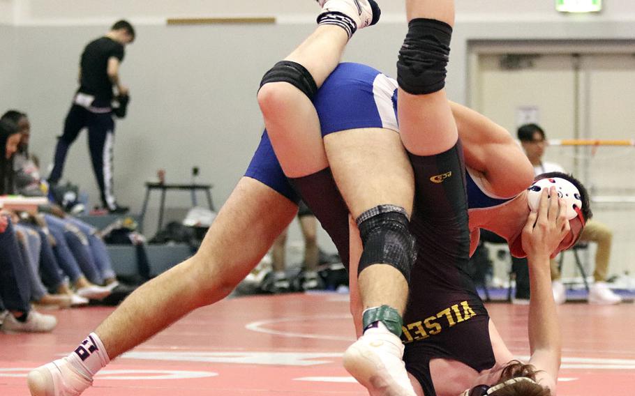 Vincent Bonavita of the Rota Admirals works on getting the upper hand against Max Bellianger of the Vilseck Falcons in the 160-pound weight calss during Saturday's wrestling tournament held at Aviano. Bonavita was able to win by pin in the last few seconds of the match.