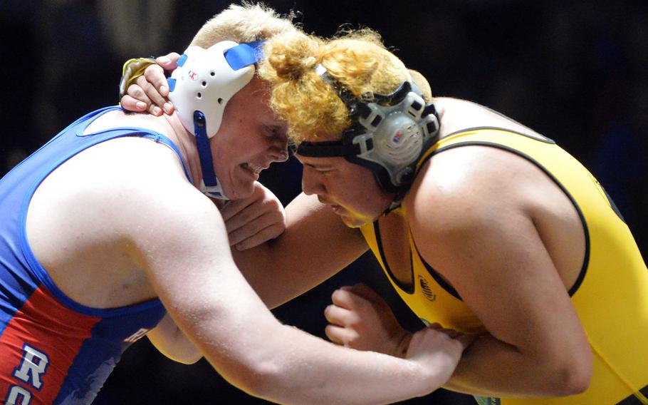 Ramstein's Theodore Ward, left, and Stuttgart's Danny Rodriguez-De Lao try to get the advantage in the 285-pound match at the DODEA-Europe wrestling finals in Wiesbaden. Germany, Saturday, Feb. 15, 2020. Ward prevailed to capture the 2020 title.