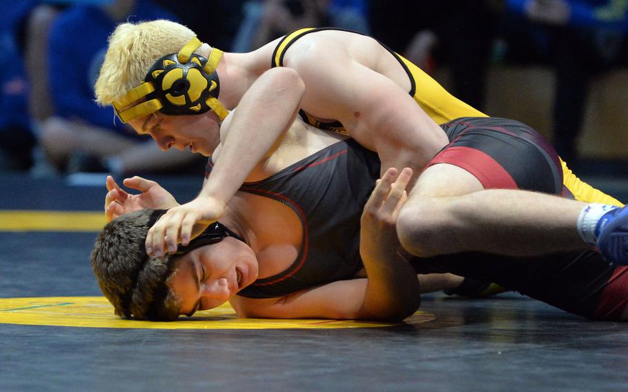 Stuttgart's Christian Just, top, defeated Ankara's Roberts Swart in the 160-pound match at the DODEA-Europe wrestling finals in Wiesbaden. Germany, Saturday, Feb. 15, 2020.