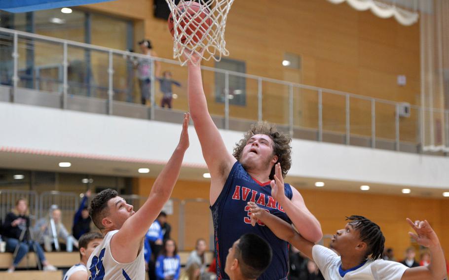 Aviano's Ben Broome goes to the hoop against the Rota defense in a Division II game at the DODEA-Europe basketball championships in Wiesbaden, Germany, Wednesday, Feb. 19, 2020. Aviano won 48-39.