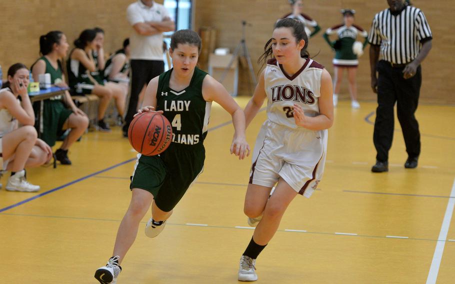 Ankara's Emma Brunick drives up the court against AFNORTH's Paula Bohlen  in a Division III game at the DODEA-Europe basketball championships in Wiesbaden, Germany, Wednesday, Feb. 19, 2020. AFNORTH beat Ankara 48-9.